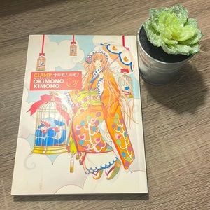 This coffee table book discusses the art of KIMONO a Japanese dress & history.